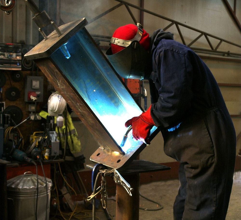 MIG welding a steel I-beam